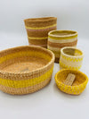 yellow set of 5 baskets . sisal . practical weave . one-of-a-kind .